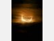 Partielle Sonnenfinsternis hinter Wolken
