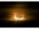 Partielle Sonnenfinsternis hinter Wolken