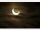 Partielle Sonnenfinsternis hinter Wolken